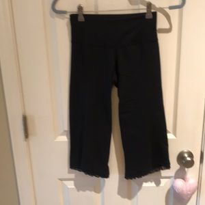 Lululemon black yoga pants, size xs, lace bottoms, crop pants.